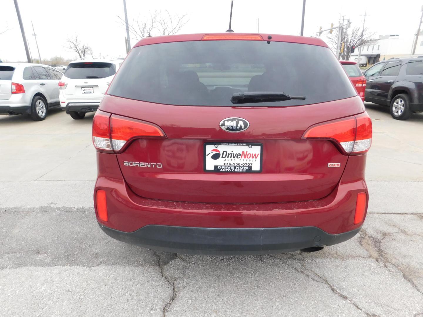 2014 RED Kia Sorento LX 2WD (5XYKT3A66EG) with an 2.4L L4 DOHC 16V engine, 6-Speed Automatic transmission, located at 2121 Burlington St, North Kansas City, MO, 64116, (816) 556-0707, 39.144707, -94.581978 - Photo#7