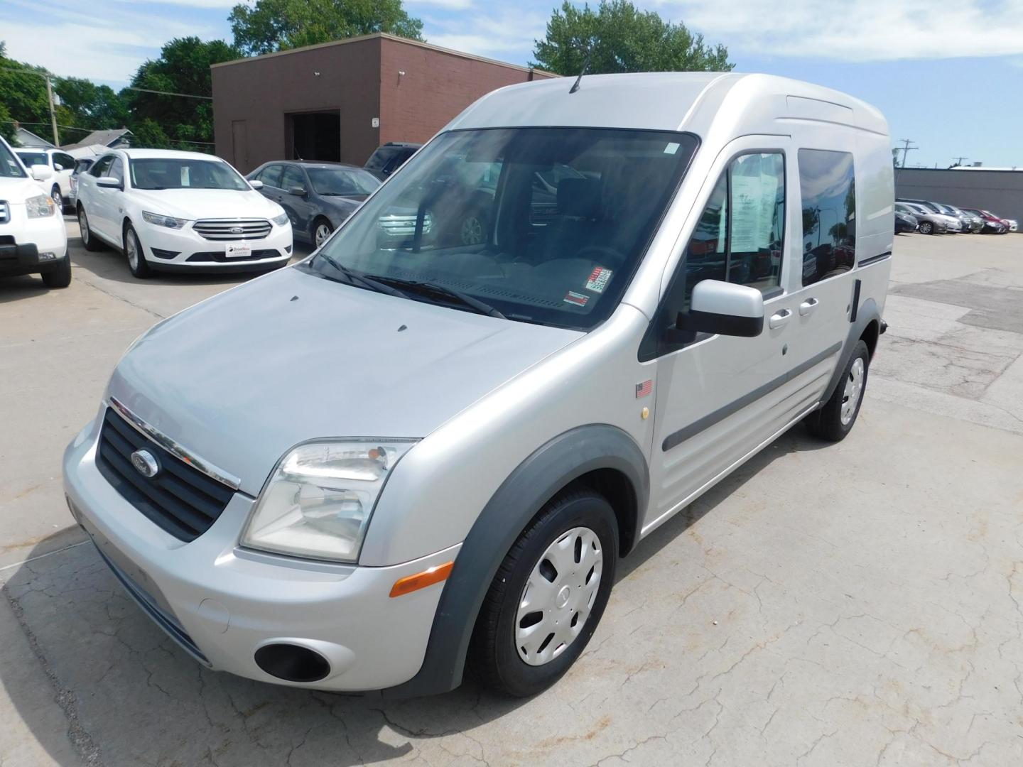 2012 SIVER Ford Transit Connect XLT Wagon (NM0KS9BN1CT) with an 2.0L L4 DOHC 16V engine, 4-Speed Automatic transmission, located at 2121 Burlington St, North Kansas City, MO, 64116, (816) 556-0707, 39.144707, -94.581978 - Photo#0