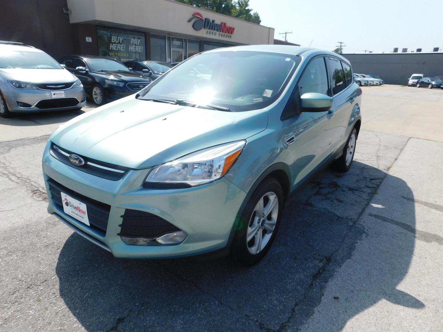 2013 GREEN Ford Escape SE FWD (1FMCU0GX9DU) with an 1.6L L4 DOHC 16V engine, 6-Speed Automatic transmission, located at 2121 Burlington St, North Kansas City, MO, 64116, (816) 556-0707, 39.144707, -94.581978 - Photo#0