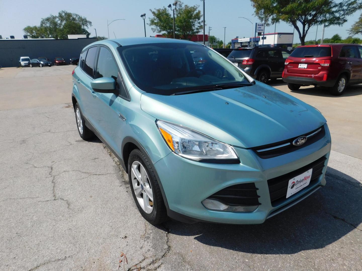 2013 GREEN Ford Escape SE FWD (1FMCU0GX9DU) with an 1.6L L4 DOHC 16V engine, 6-Speed Automatic transmission, located at 2121 Burlington St, North Kansas City, MO, 64116, (816) 556-0707, 39.144707, -94.581978 - Photo#8