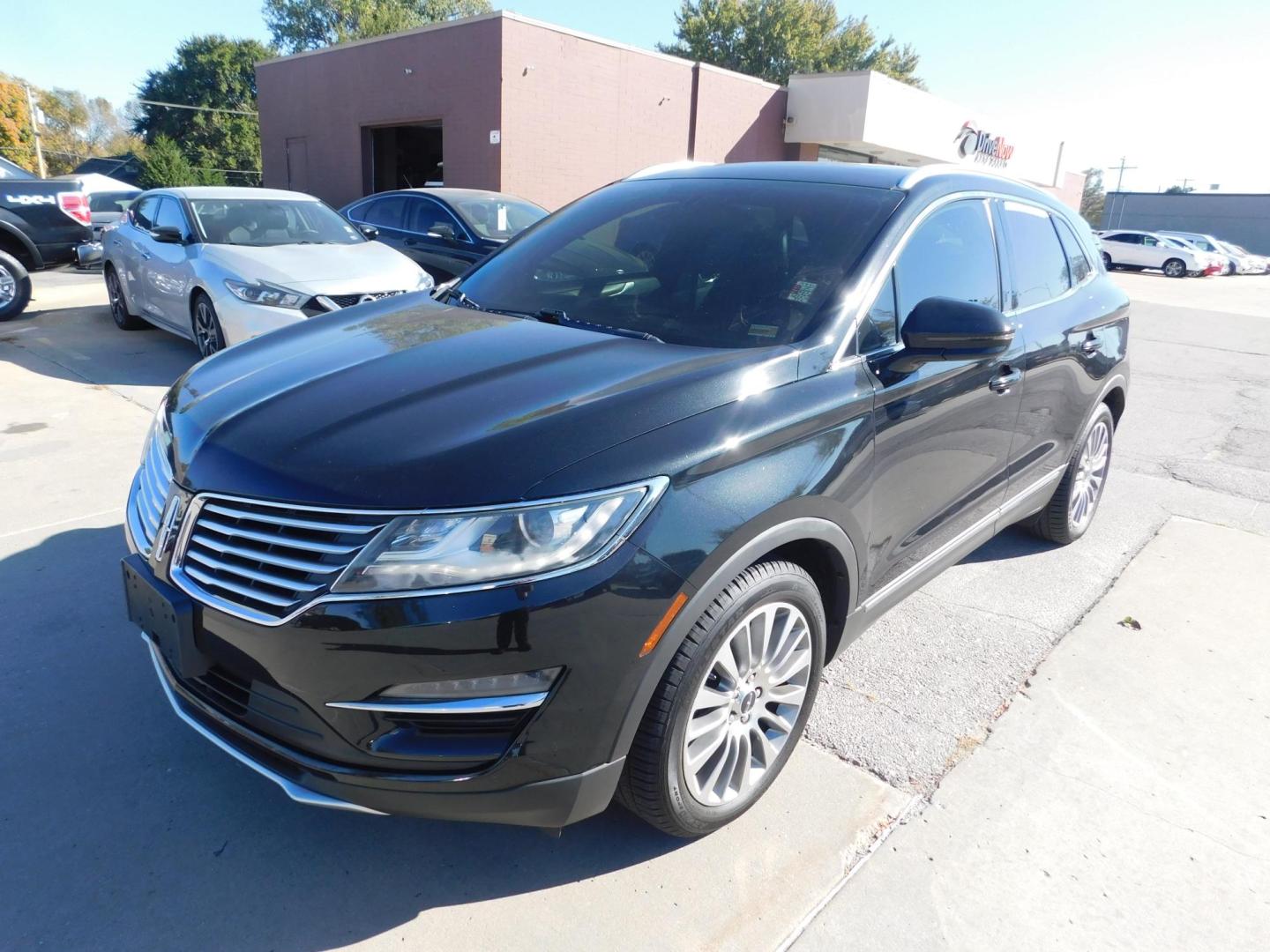 2015 BLACK Lincoln MKC FWD (5LMCJ1A9XFU) with an 2.0L L4 DOHC 16V engine, 6-Speed Automatic transmission, located at 2121 Burlington St, North Kansas City, MO, 64116, (816) 556-0707, 39.144707, -94.581978 - Photo#0