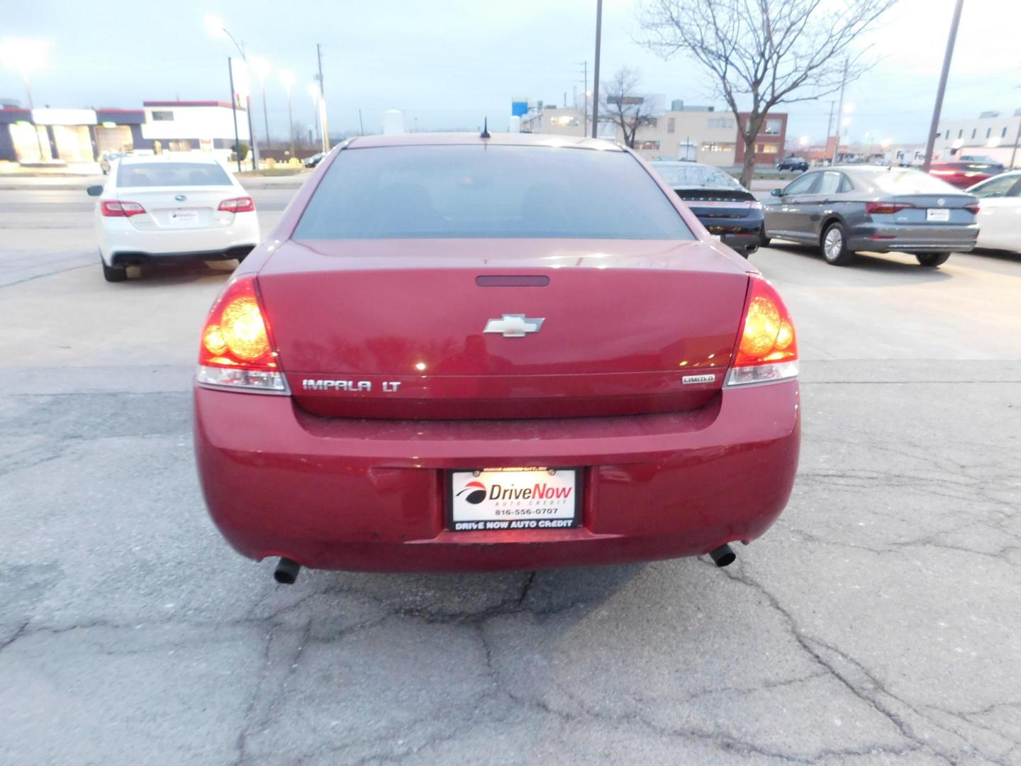 2014 RED Chevrolet Impala LT (2G1WB5E39E1) with an 3.6L V6 DOHC 16V FFV engine, 6-Speed Automatic transmission, located at 2121 Burlington St, North Kansas City, MO, 64116, (816) 556-0707, 39.144707, -94.581978 - Photo#8