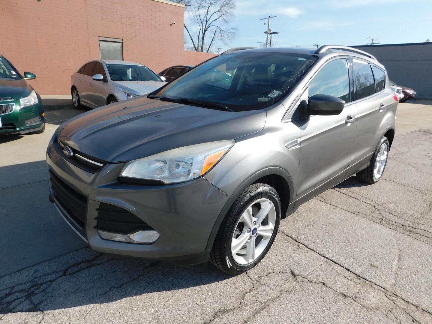 2014 GRAY Ford Escape SE 4WD (1FMCU9GXXEU) with an 1.6L L4 DOHC 16V engine, 6-Speed Automatic transmission, located at 2121 Burlington St, North Kansas City, MO, 64116, (816) 556-0707, 39.144707, -94.581978 - Photo#0