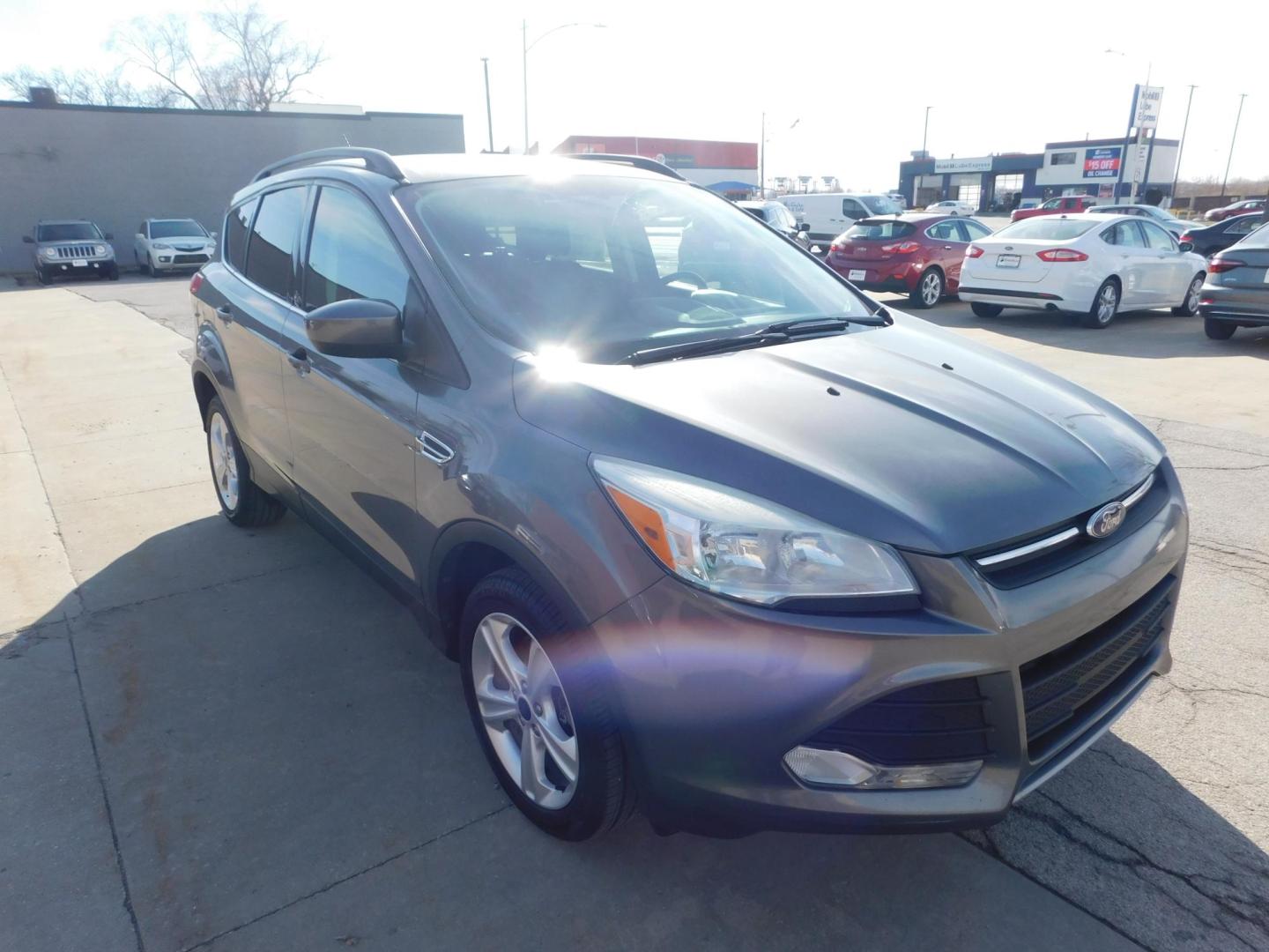 2014 GRAY Ford Escape SE 4WD (1FMCU9GXXEU) with an 1.6L L4 DOHC 16V engine, 6-Speed Automatic transmission, located at 2121 Burlington St, North Kansas City, MO, 64116, (816) 556-0707, 39.144707, -94.581978 - Photo#11